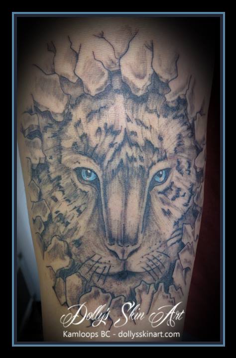 black and grey tiger breaking out of rock blue eye tattoo