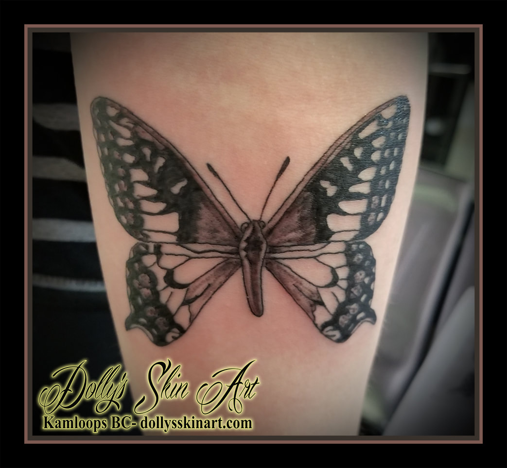 black and grey small butterfly lined shaded tattoo kamloops dolly's skin art