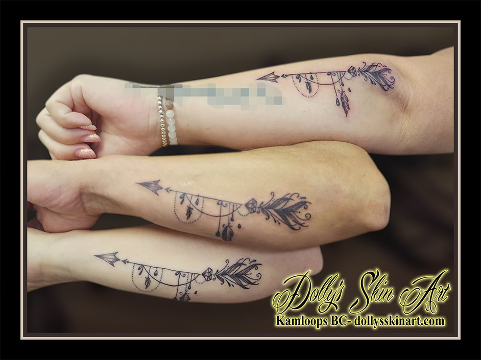arrow tattoo black and grey shading arm matching friends forarm tattoo kamloops dolly's skin art