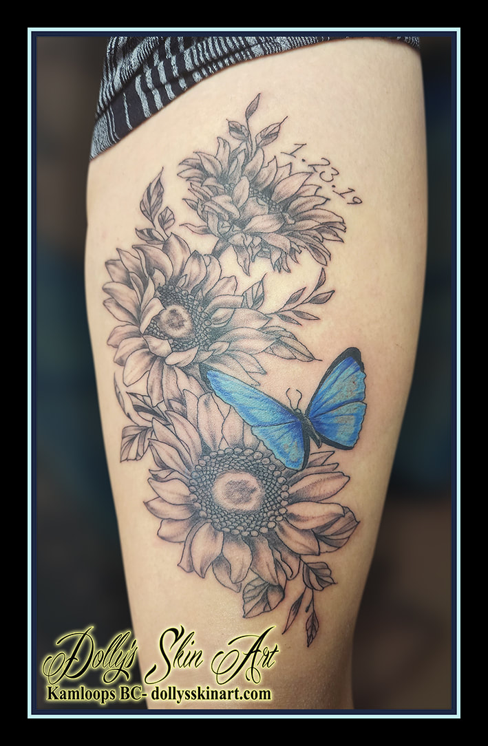 butterfly tattoo blue black and grey shading sun flower floral leg tattoo kamloops dolly's skin art