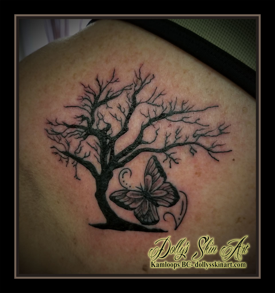 black and grey solid orchard tree butterfly filigree shoulder tattoo kamloops dolly's skin art