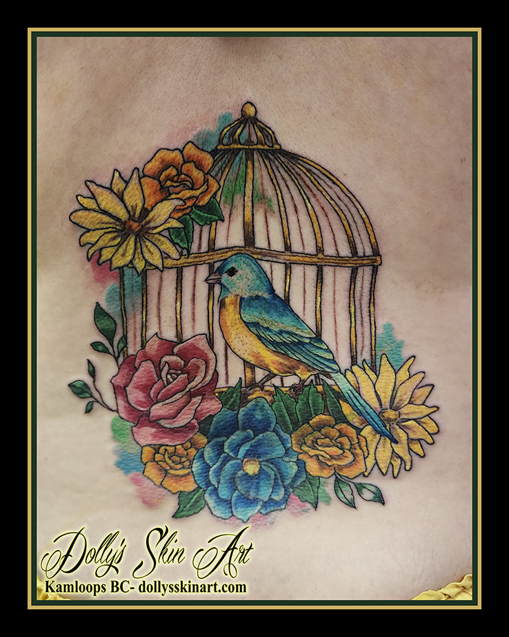 birdcage tattoo bird flowers colour back tattoo kamloops dolly's skin art