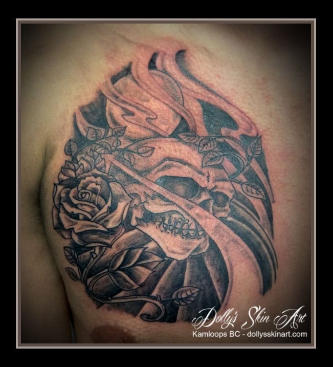 black and grey traditional style skull moon flower rose chest tattoo kamloops dolly's skin art
