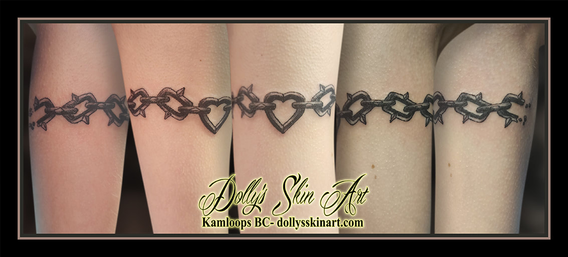 heart chain tattoo broken wrapping black and grey bicep shading tattoo kamloops dolly's skin art