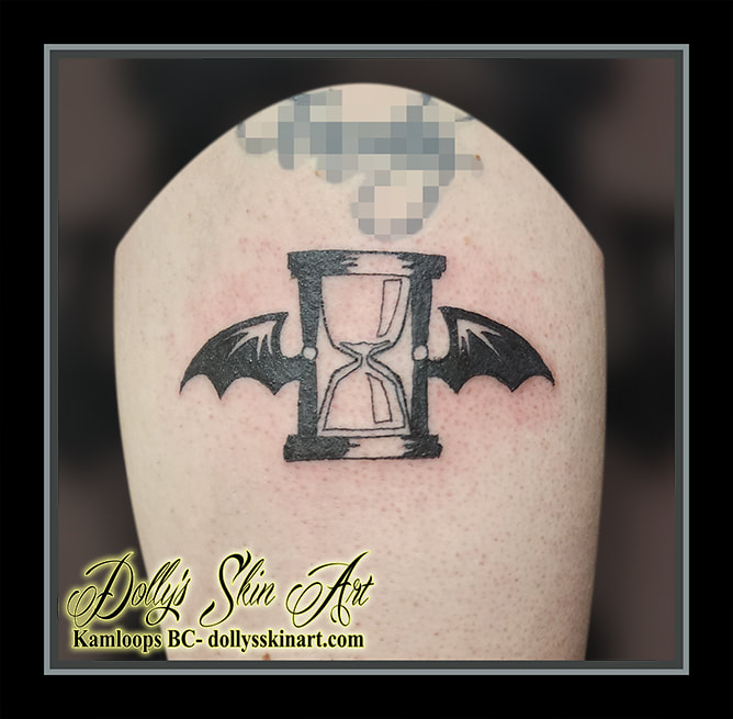 hourglass tattoo wings black arm tattoo kamloops dolly's skin art