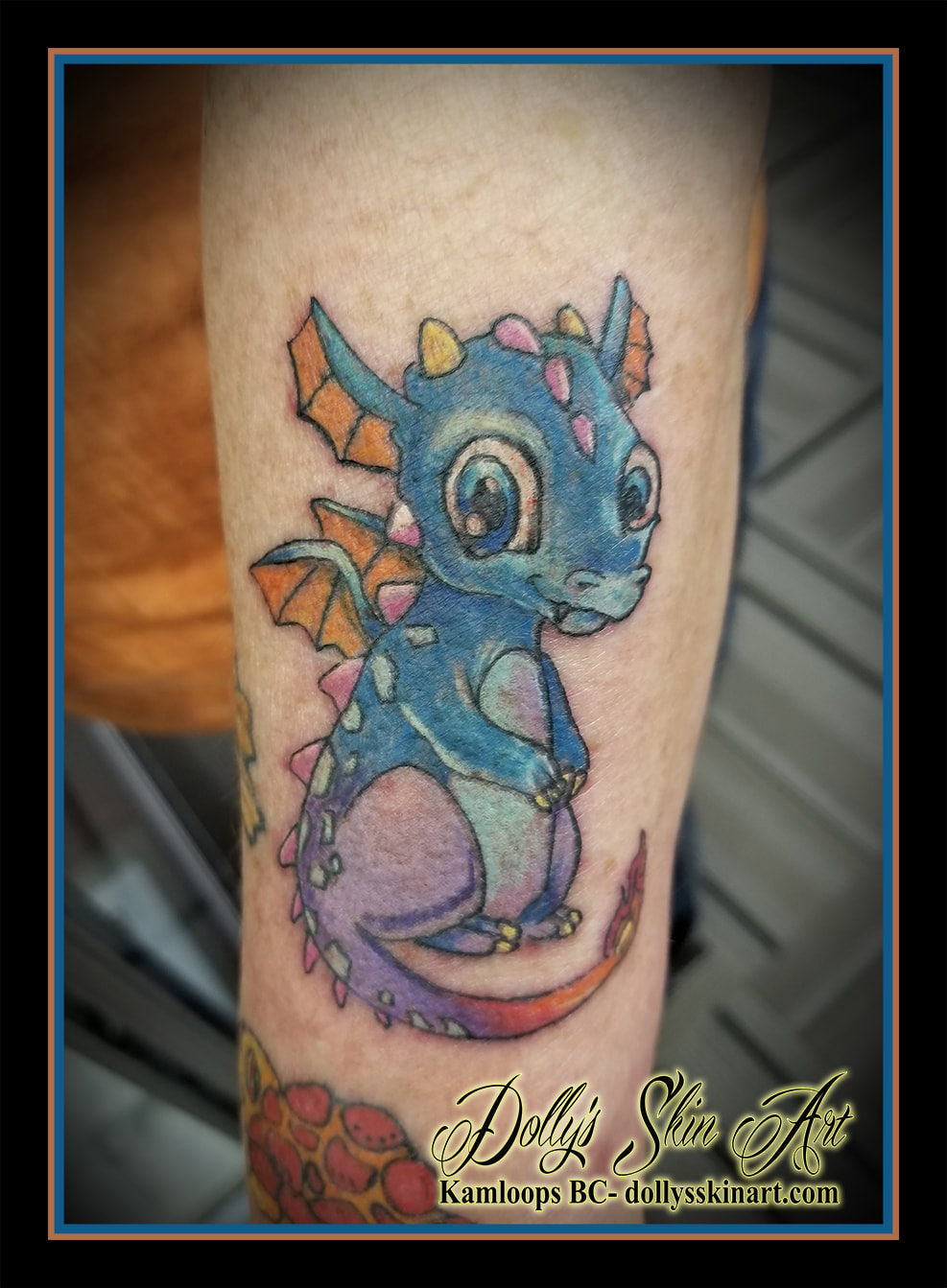 small colour cartoon animated blue dragon tattoo kamloops dolly's skin art