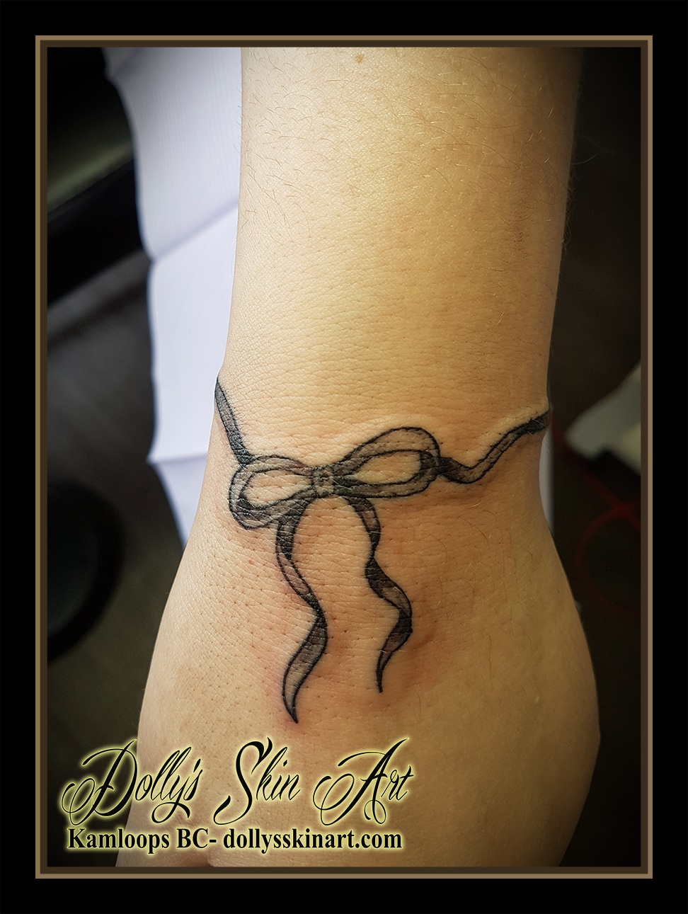 small black ribbon bow wrist bracelet shaded tattoo kamloops dolly's skin art
