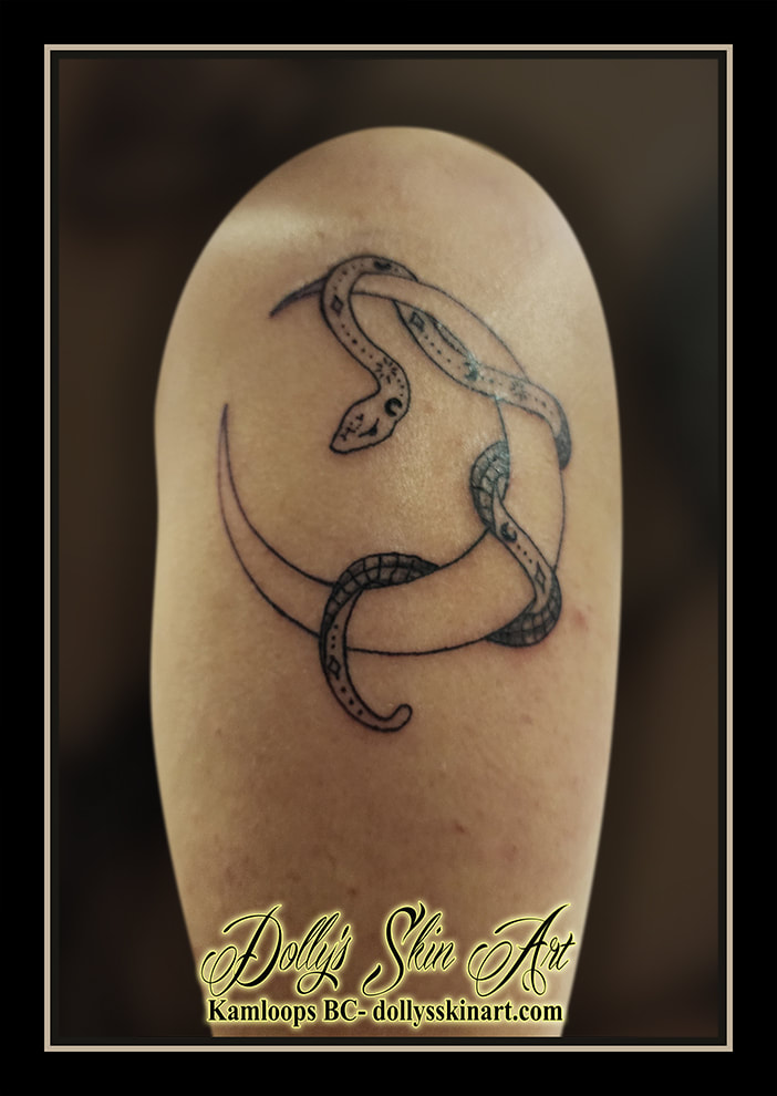snake moon tattoo arm black line work tattoo kamloops dolly's skin art