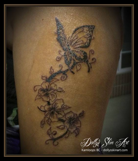 simple black flowers butterfly arm tattoo kamloops dolly's skin art