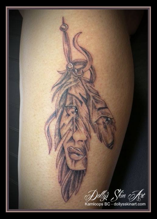 black and grey face on feathers first nation tattoo kamloops dolly's skin art