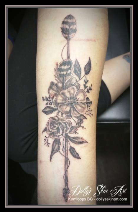 black and grey shading flowers wooden arrow arm tattoo kamloops dolly's skin art