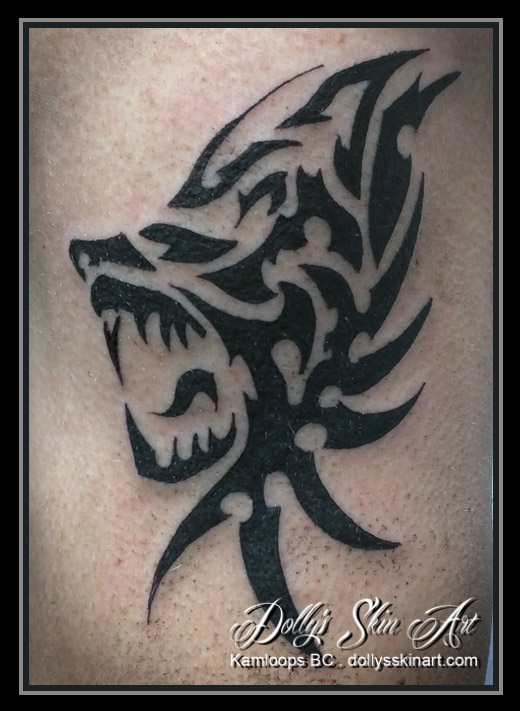 black tribal custom wolf tattoo