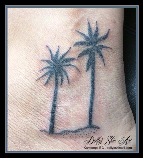 black pal tree silhouette foot tattoo