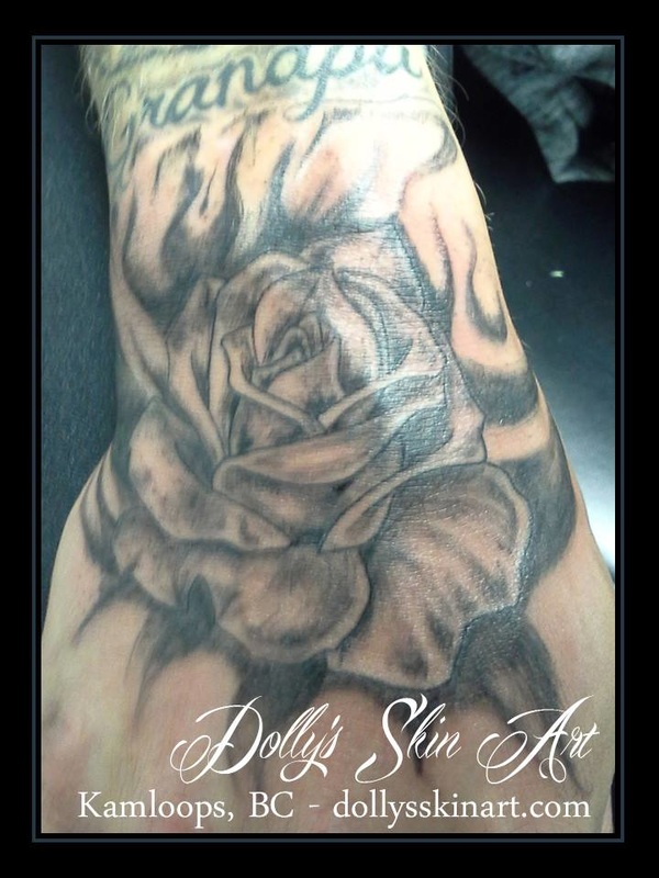 rose hand tattoo black