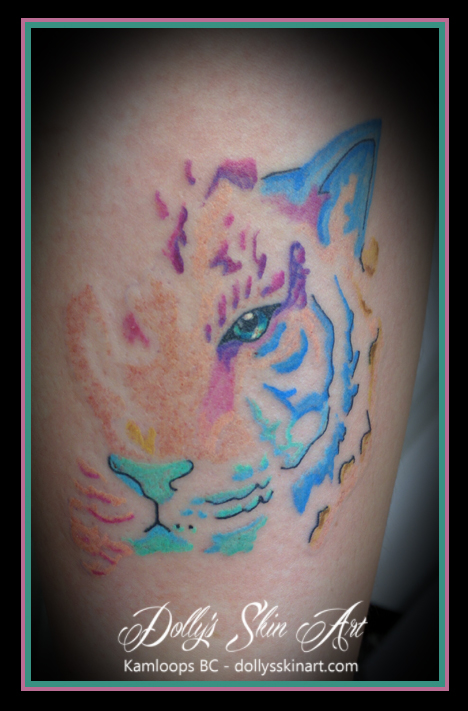 Whitney's small pretty watercolour style tiger tattoo