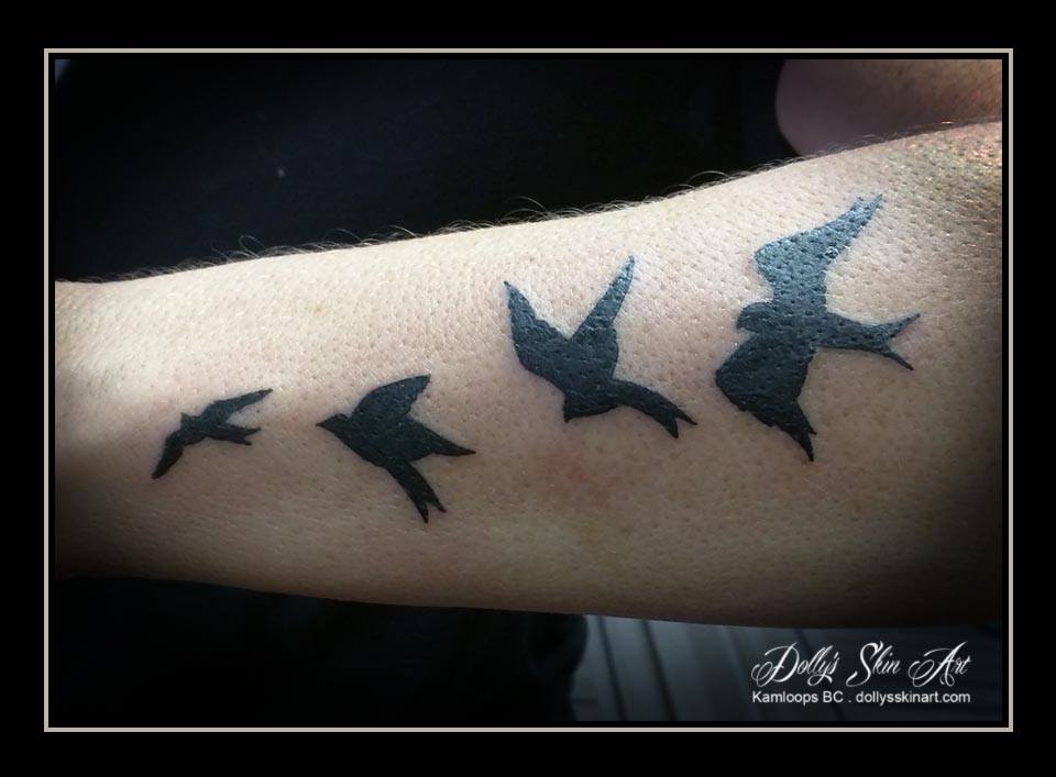 Nicole's little black birds tattoo
