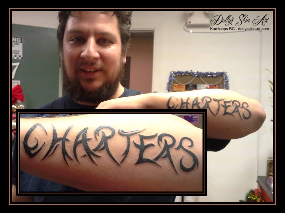 charters tribal black arm tattoo