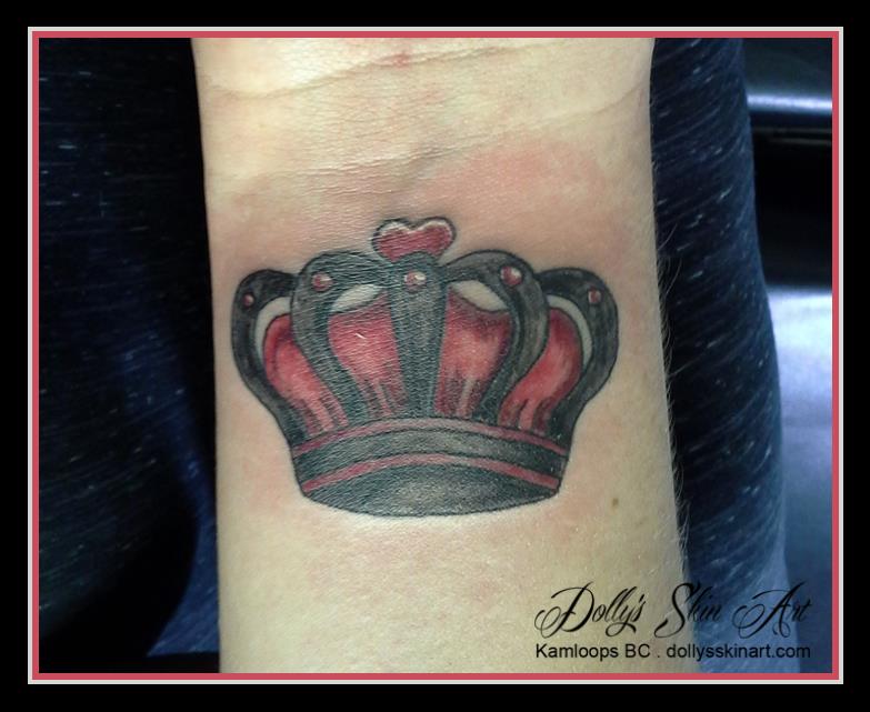 red black crown wrist tattoo