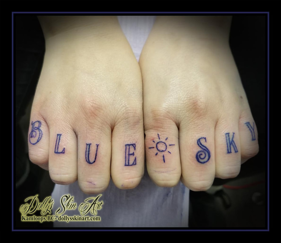 blue sky tattoo blue lettering font script sun linework finger knuckle tattoo kamloops dolly's skin art