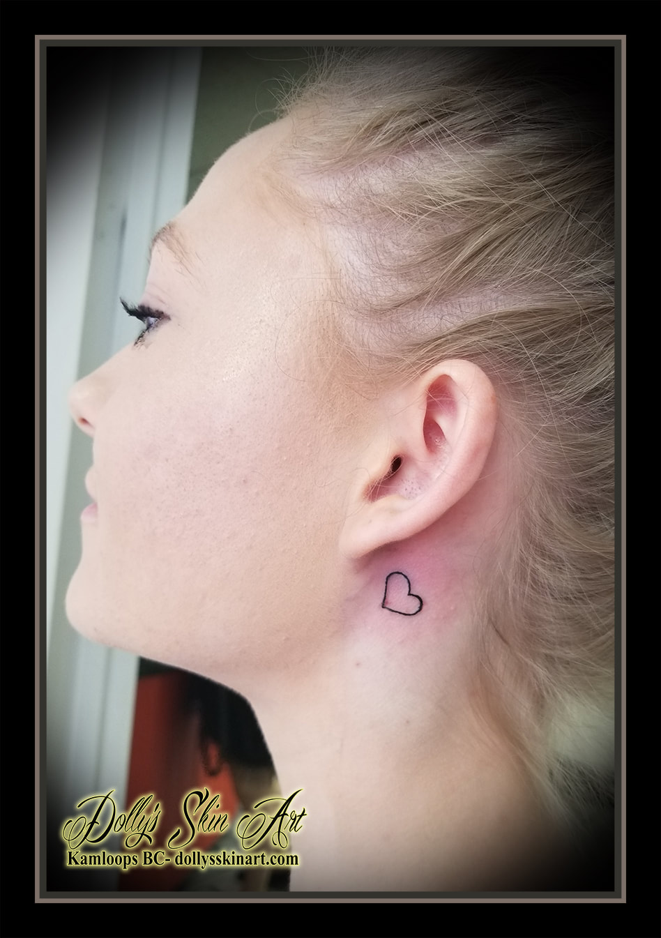 small black heart outline behind ear tattoo kamloops tattoo dolly's skin art