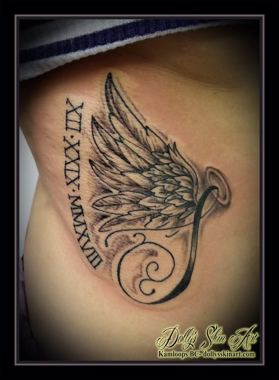 memorial tattoo wing feathers roman numerals halo shadingside black and grey tattoo kamloops tattoo dolly's skin art