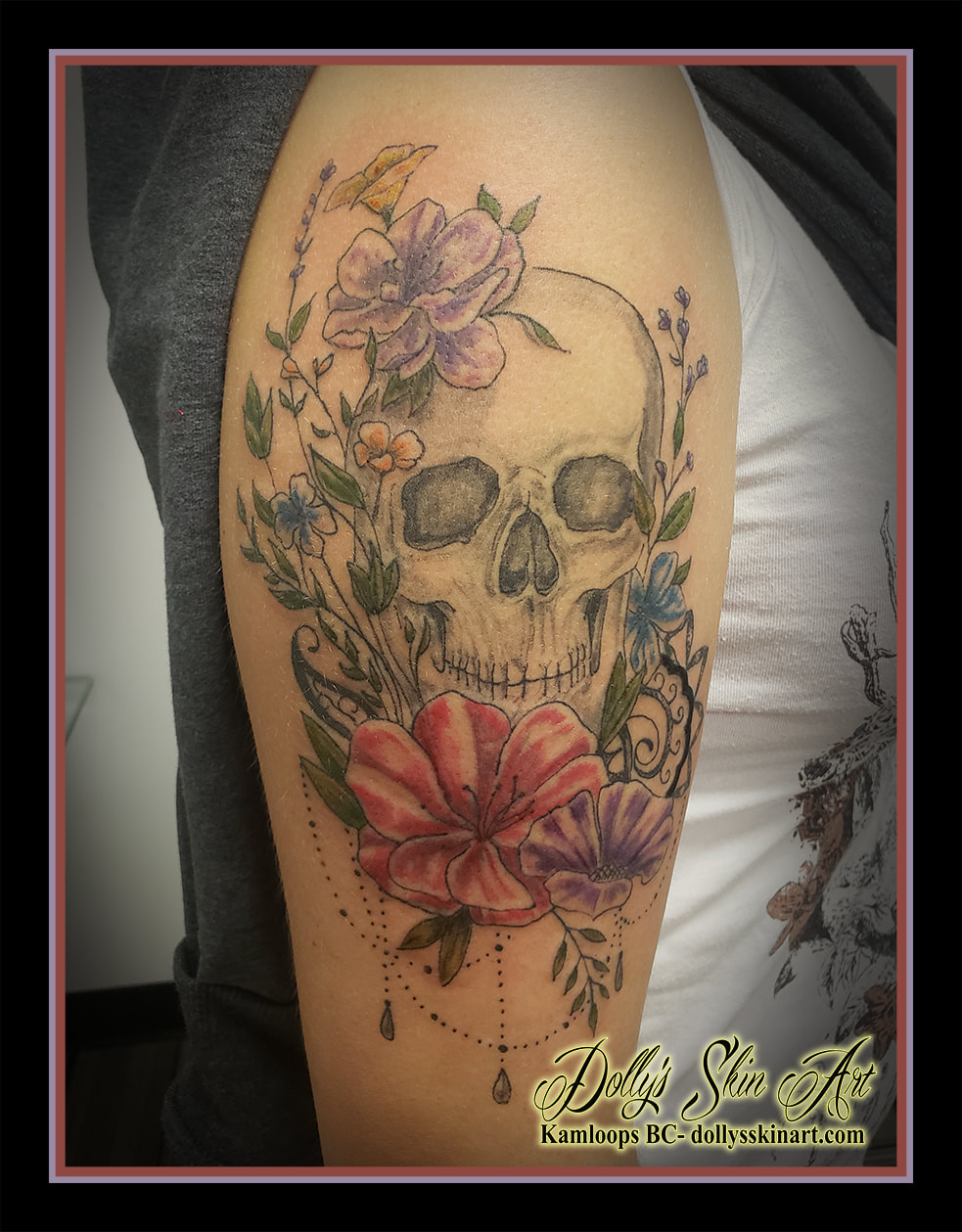 skull tattoo flowers colour black and grey filigree wildflowers purple yellow pink orange blue green beads shoulder tattoo kamloops dolly's skin art