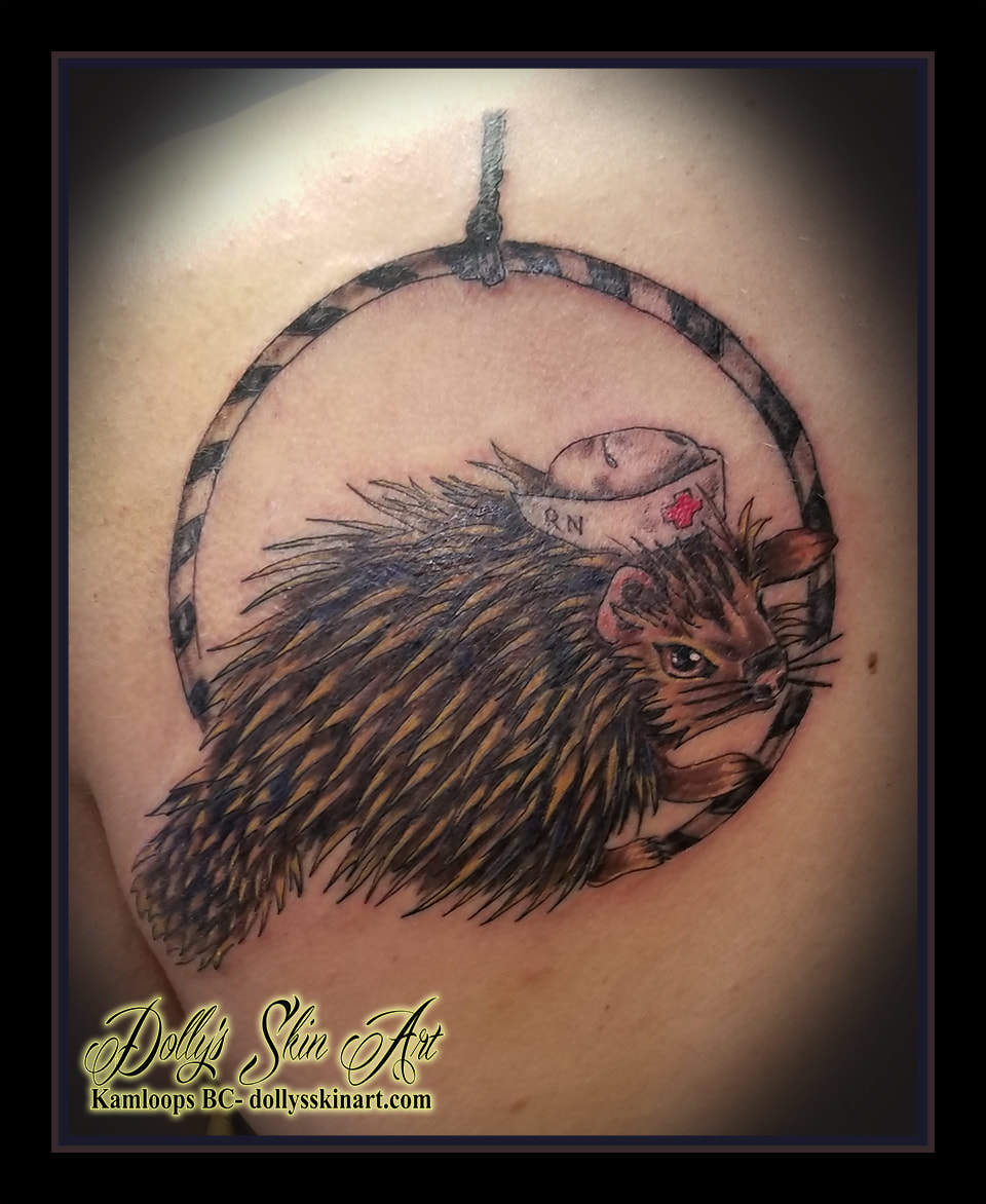 porcupine colour tattoo nurse hat gymnastic aerial hoop brown black red shading back shoulder blade tattoo kamloops dolly's skin art