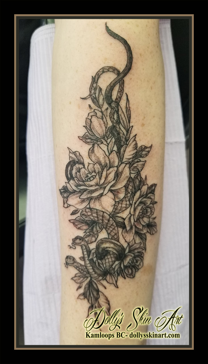 snake roses tattoo black and grey shading leaves flowers floral serpent tattoo kamloops dolly's skin art