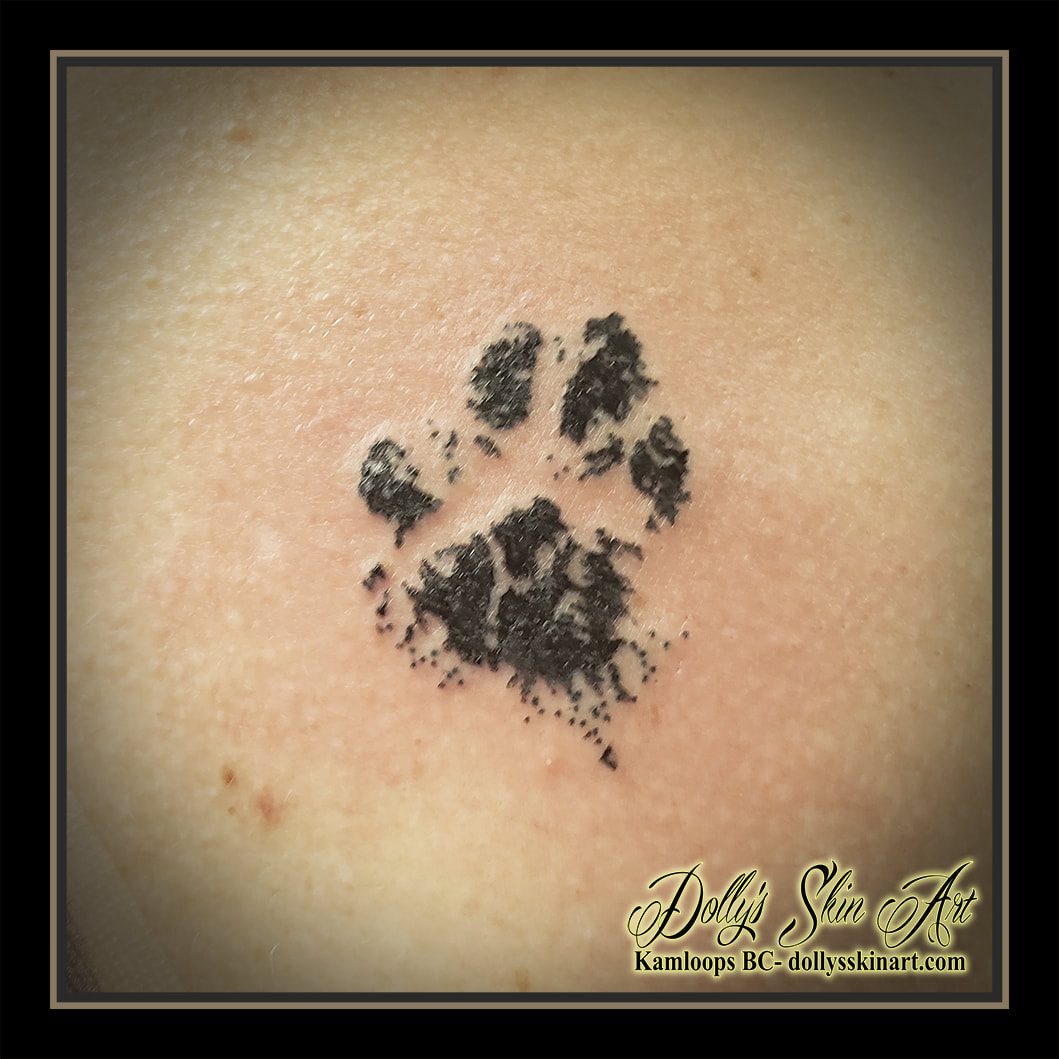 paw print tattoo black ink tattoo kamloops dolly's skin art