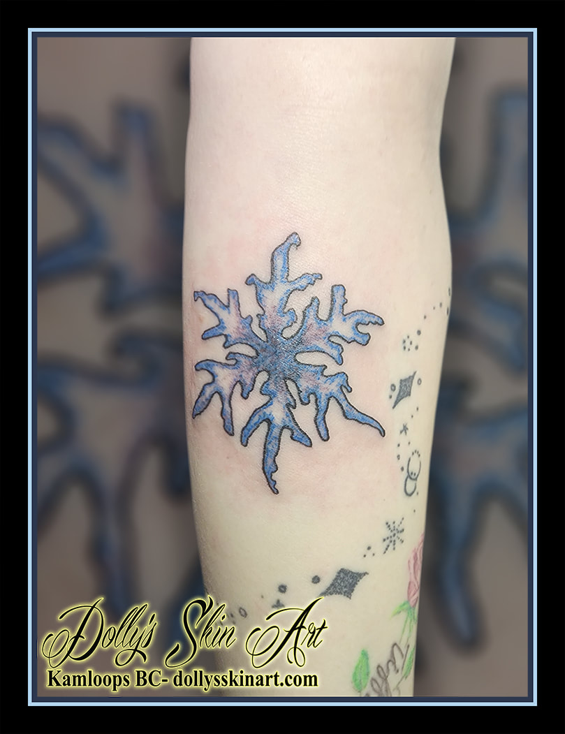 snowflake tattoo tired snow flake colour purple pink blue forearm tattoo kamloops dolly's skin art