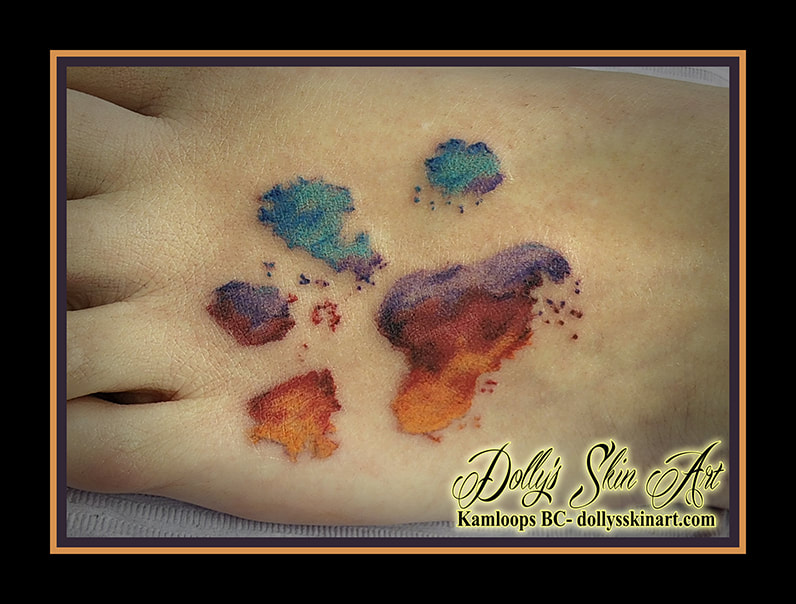 paw print tattoo water colour foot blue purple red orange yellow white tattoo dolly's skin art kamloops