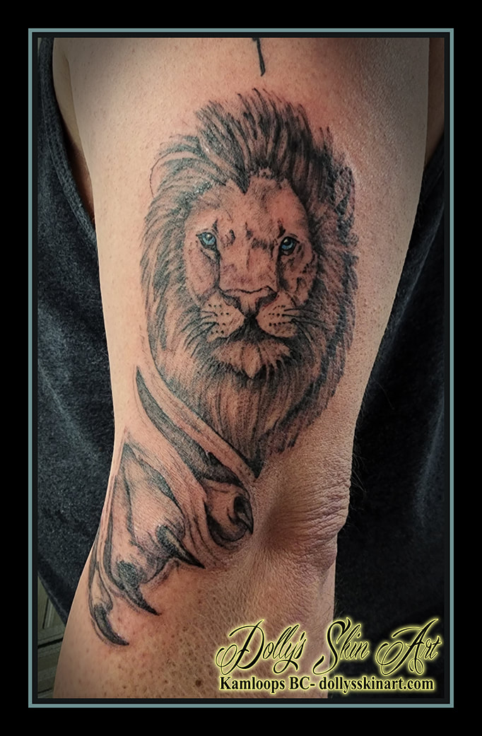 lion tattoo black and grey shading blue eye arm tattoo dolly's skin art kamloops