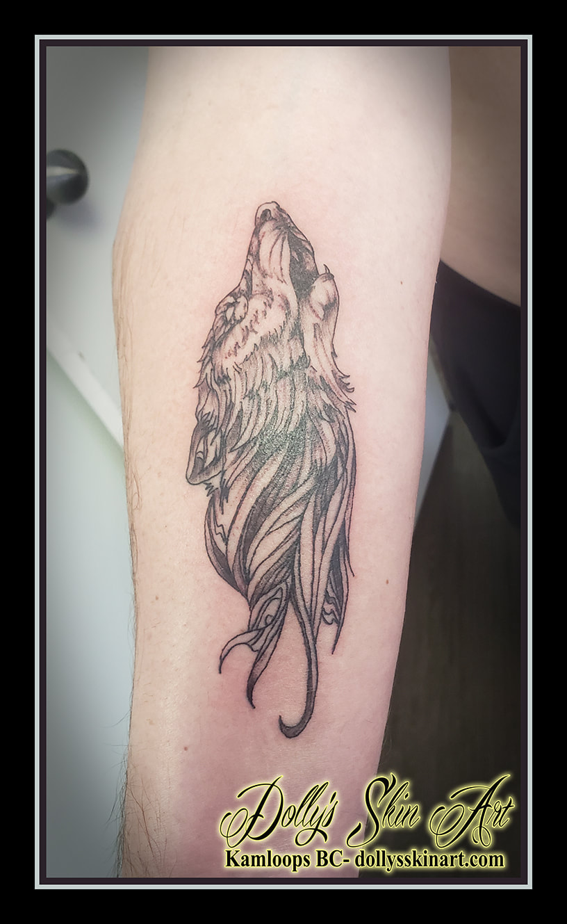 wolf tattoo black and grey forearm linework shading howling dolly's skin art kamloops