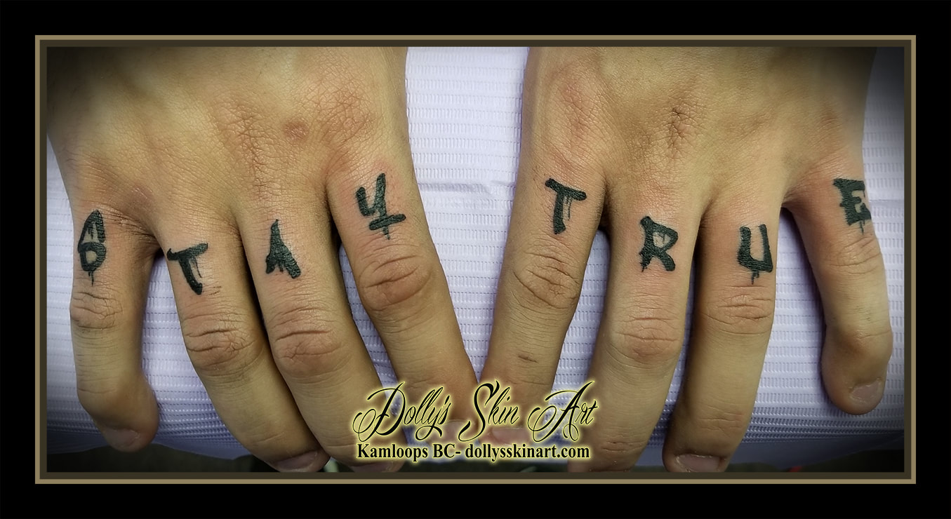 stay true finger tattoo black lettering font knuckles script letters tattoo kamloops dolly's skin art