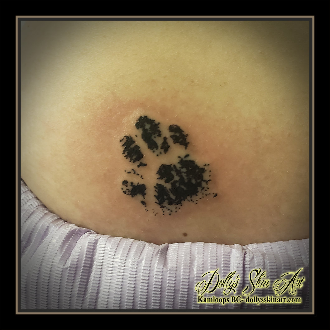 paw print tattoo black ink tattoo kamloops dolly's skin art
