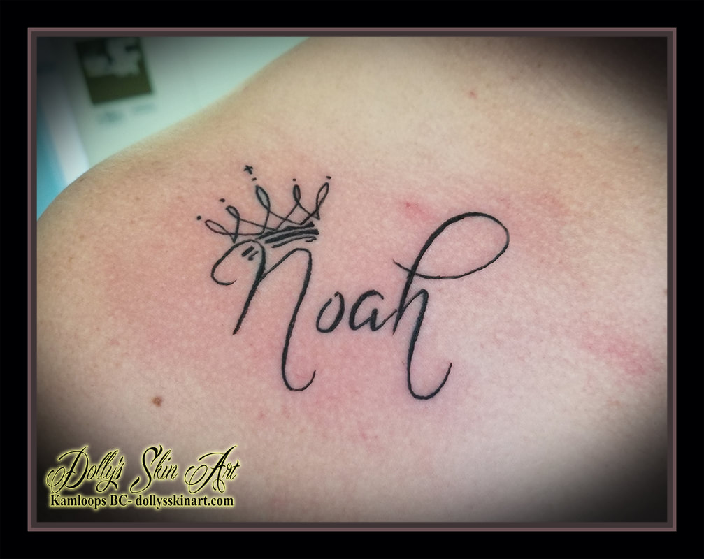 noah tattoo son children crown black lettering font script collarbone tattoo kamloops dolly's skin art