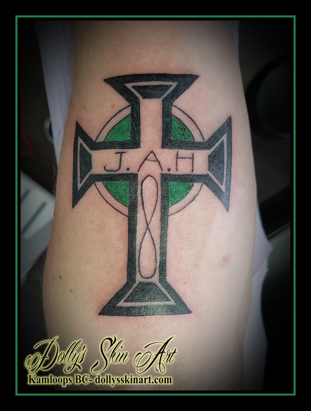 Celtic cross green black lettering font memorial infinity forearm tattoo kamloops dolly's skin art