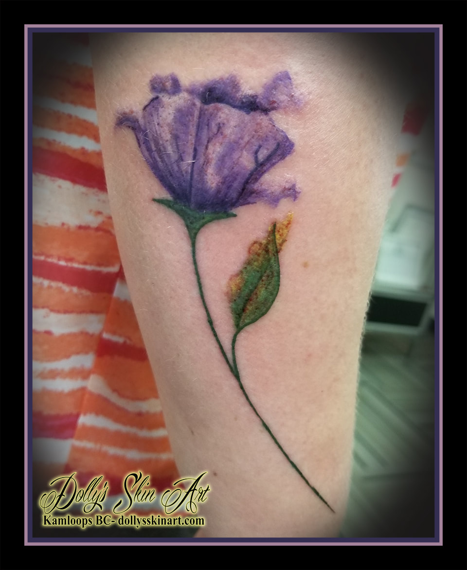 purple flower tattoo colour leaves green purple forearm tattoo kamloops dolly's skin art