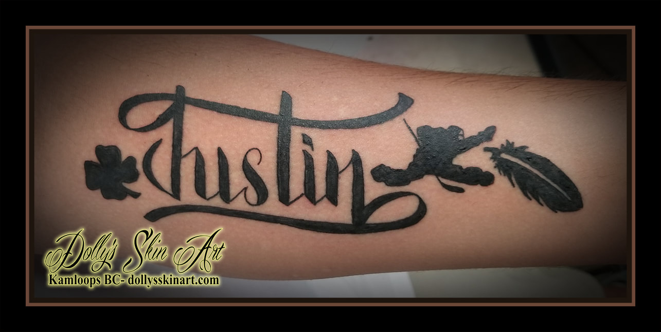 justin kaelan tattoo black silhouette hockey player goalie four leaf clover feather forearm matching font lettering script tattoo kamloops dolly's skin art
