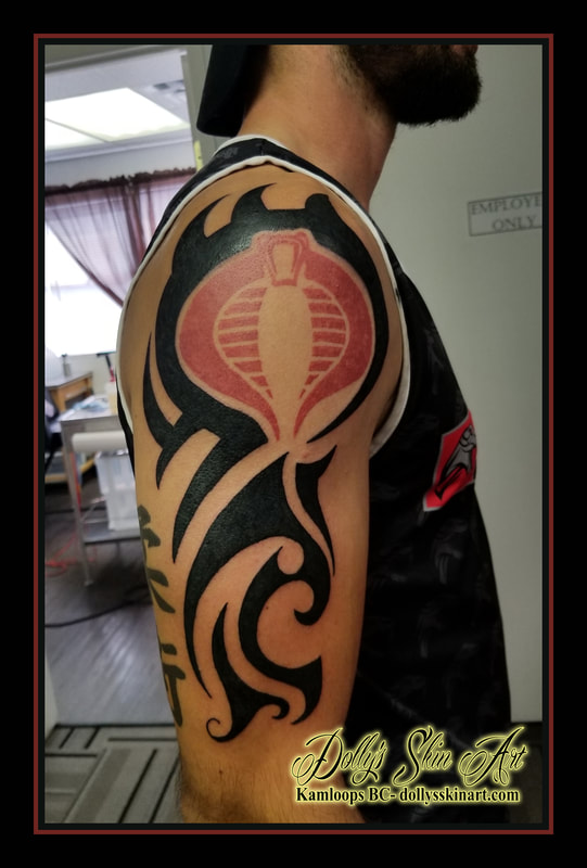 black custom tribal solid arm shoulder bicep gi joe cobra red tattoo kamloops tattoo dolly's skin art
