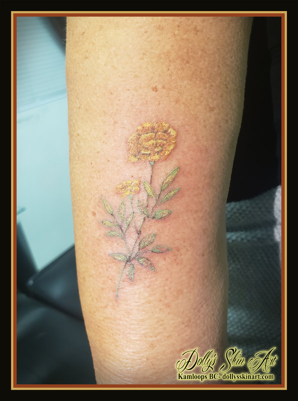 marigold tattoo matching tattoos mother daughter flower floral colour green yellow orange tattoo kamloops dolly's skin art