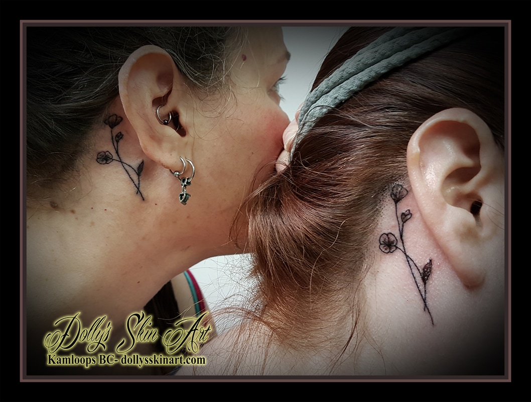 tiny small two black and grey flowers behind the ear single line best friend bond fineline tattoo kamloops dolly's skin art