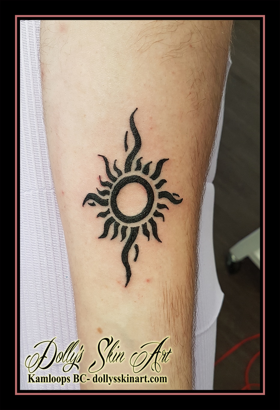 tribal black sun arm tattoo kamloops dolly's skin art