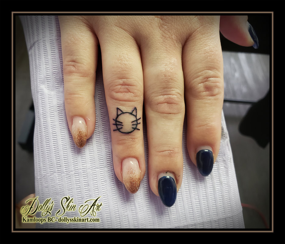 cat tattoo finger outline linework kitty ring finger black tattoo kamloops dolly's skin art
