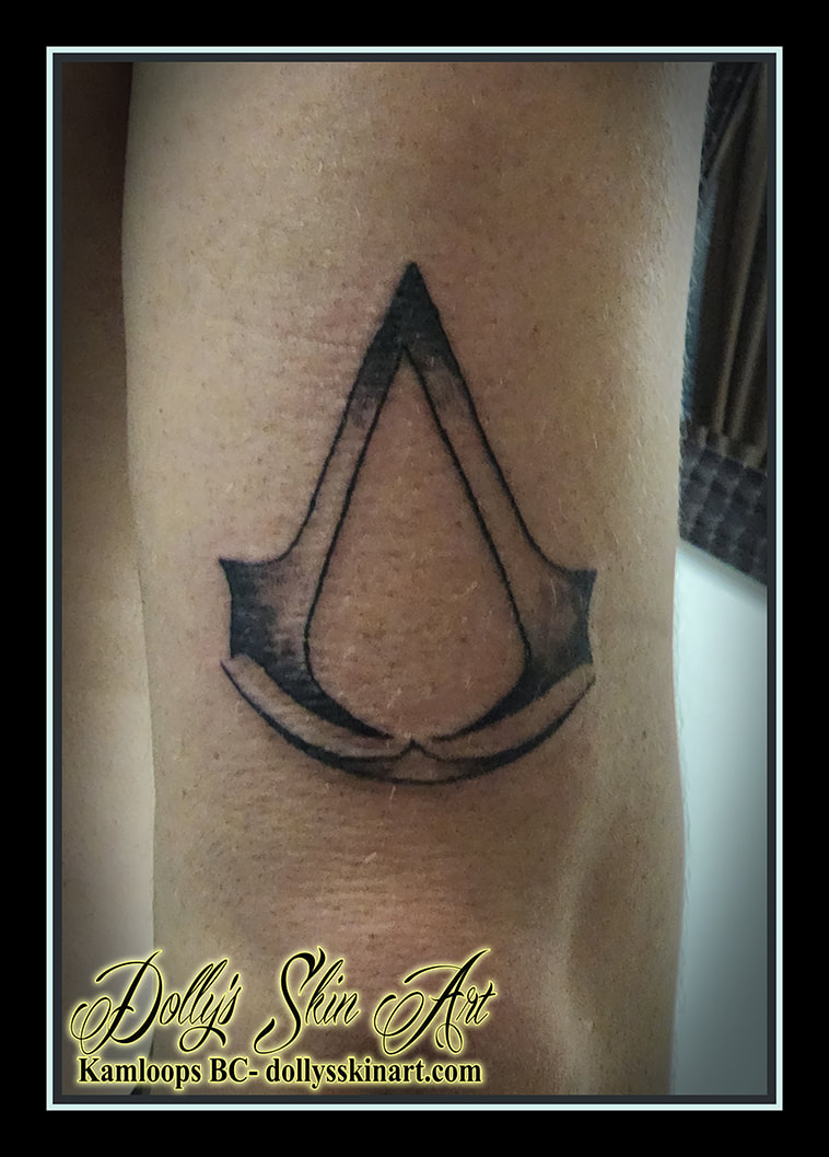 Assassin's Creed tattoo sigil 2 brotherhood black and grey arm shading tattoo dolly's skin art kamloops british columbia