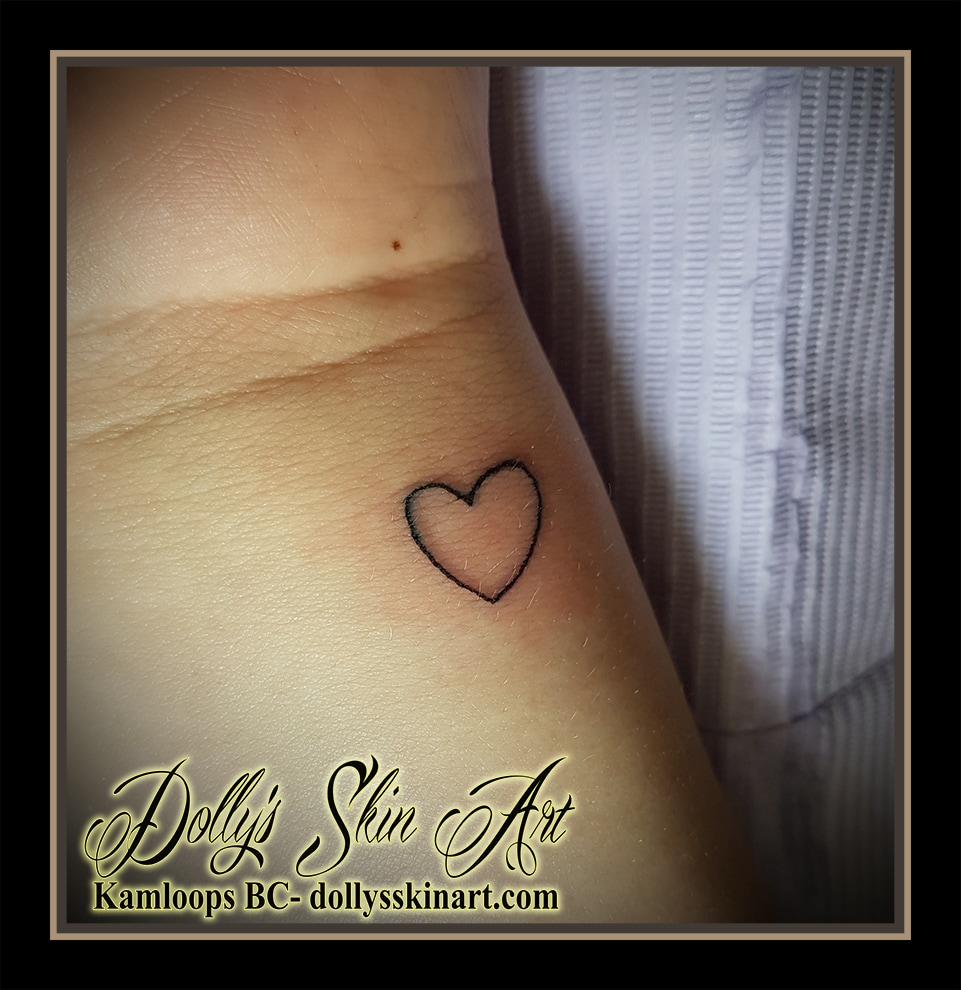small black single line outline heart wrist tattoo kamloops dolly's skin art