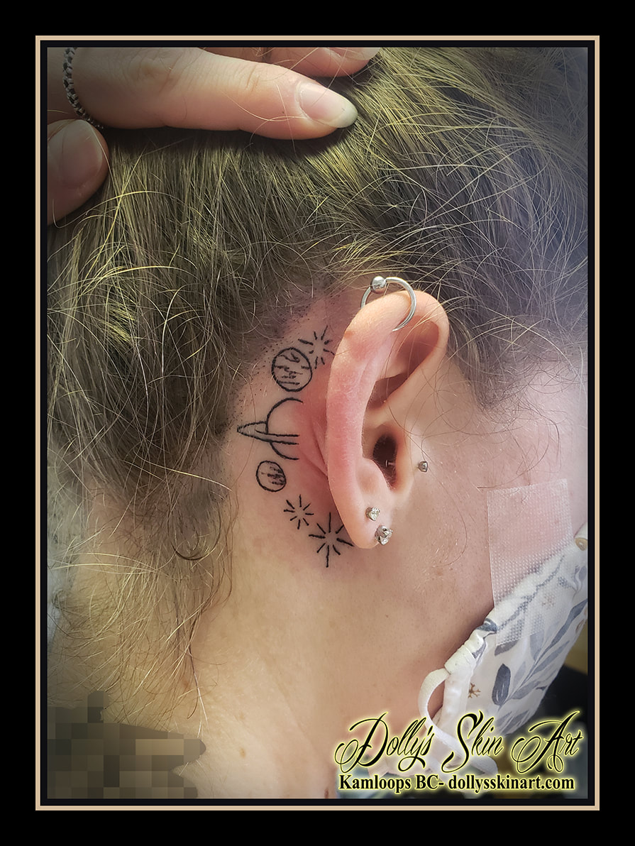 planets stars tattoo behind ear linework black rings tattoo dolly's skin art kamloops
