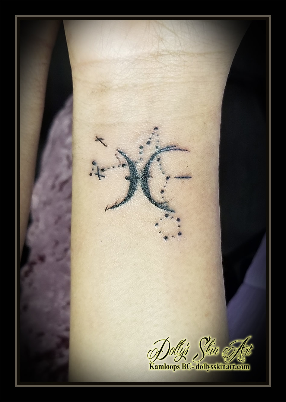 pisces astrological symbol black abstract wrist tattoo kamloops dolly's skin art