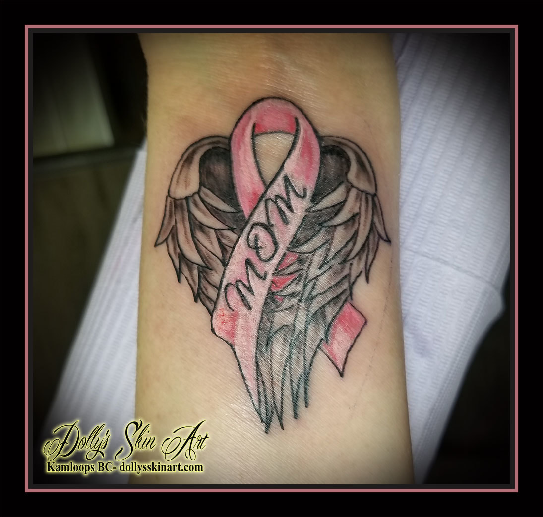 mom pink breast cancer ribbon tribute wings black and grey wrist tattoo kamloops dolly's skin art