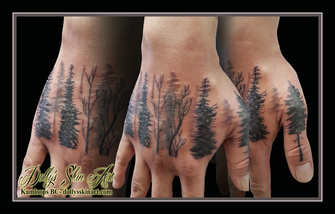 black trees forest silhouette back of hand tattoo solid and shading kamloops dolly's skin art